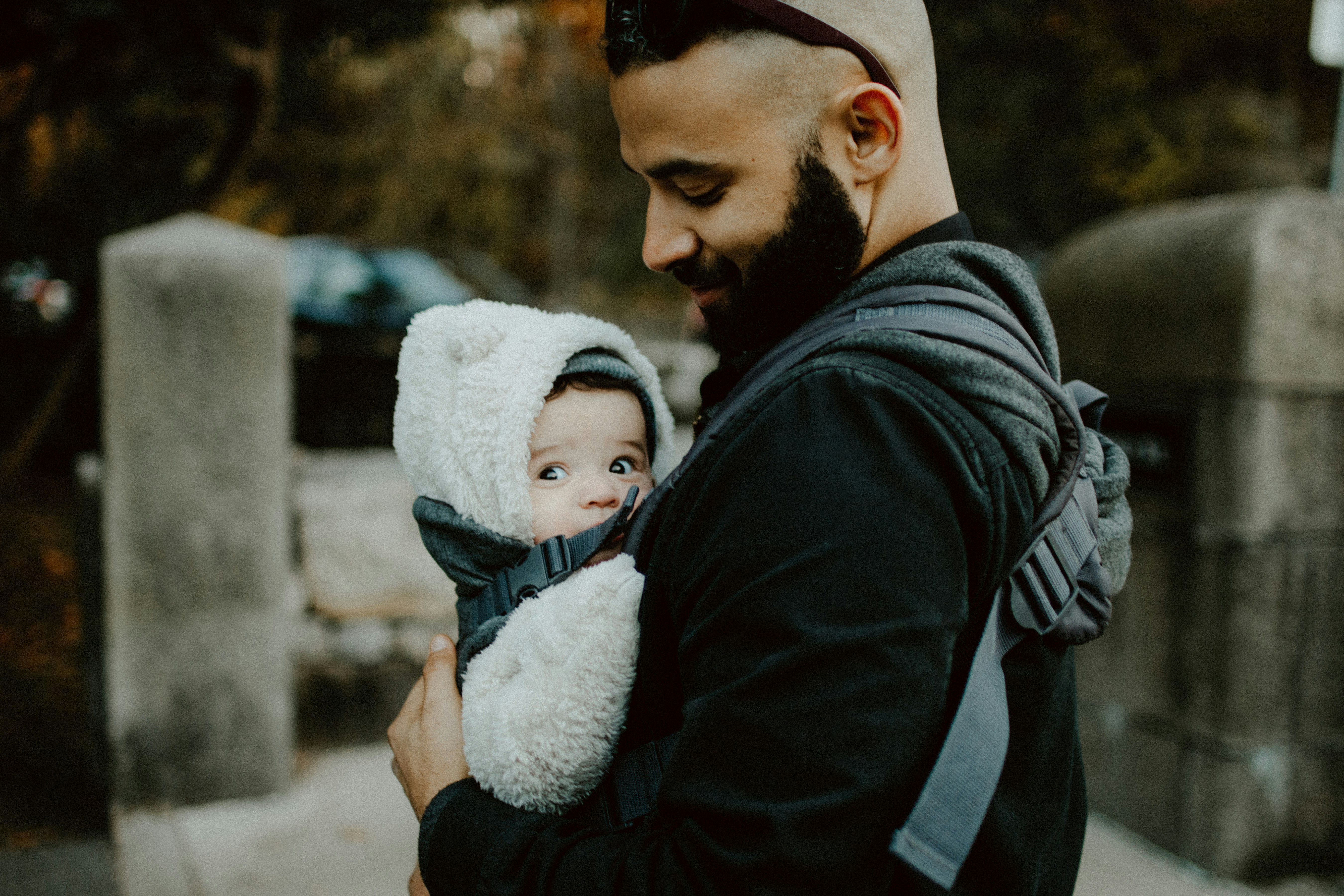 man carrying baby